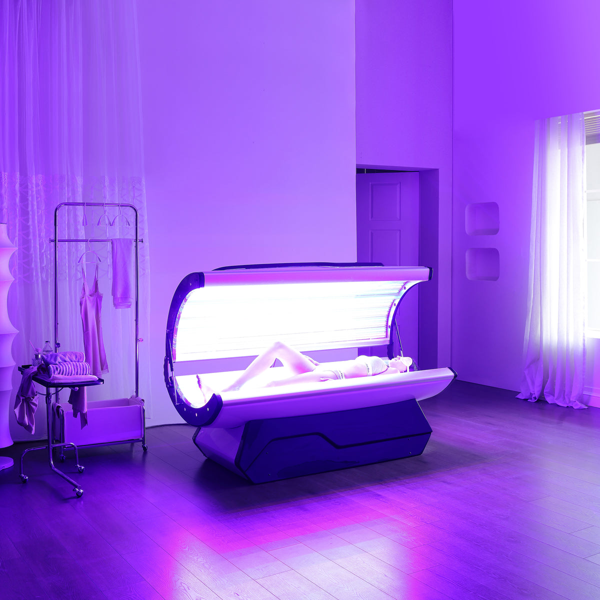 The Capsule open and lit in a bedroom.